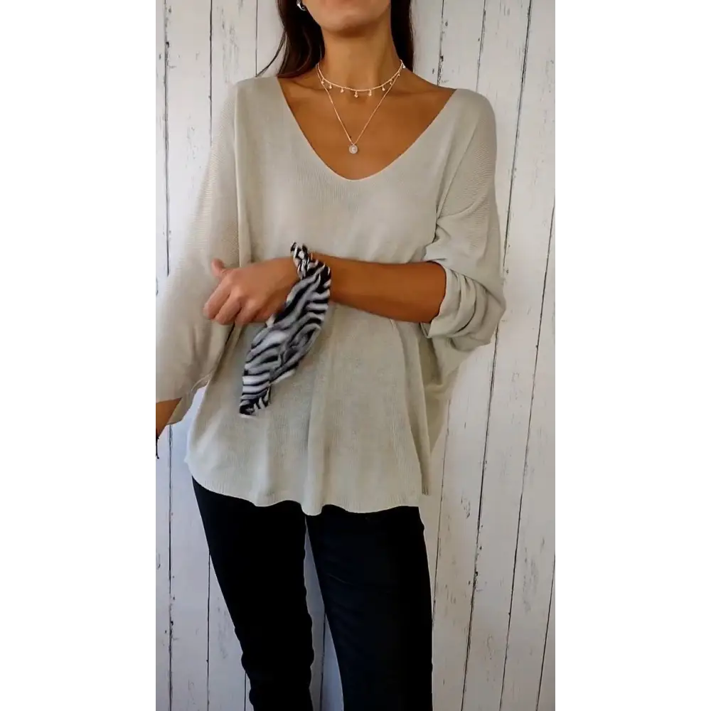 Blusa confortável de mangas longas com decote em V